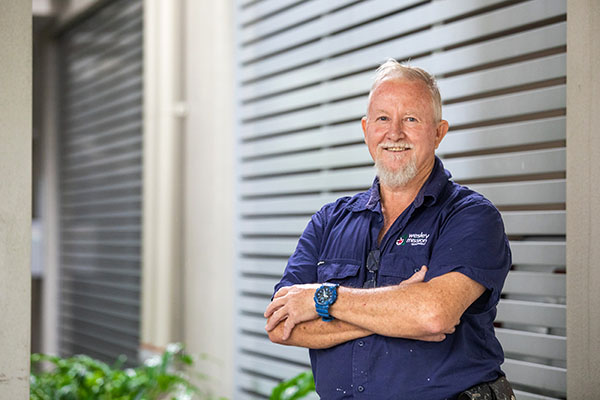 Image representing jobs and careers at Wesley Mission Queensland, Brisbane. It shows a male staff member smiling at the camera.