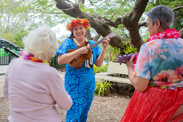 Image representing jobs and careers at Wesley Mission Queensland, Brisbane. It shows Hawaiian guitar players at Balmoral open day