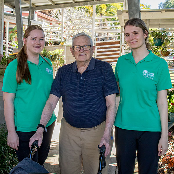 Traineeship students with a resident from one of Wesley Missions Queensland's aged care communities.