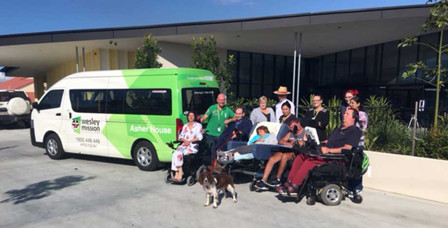 Asher House residents with community bus