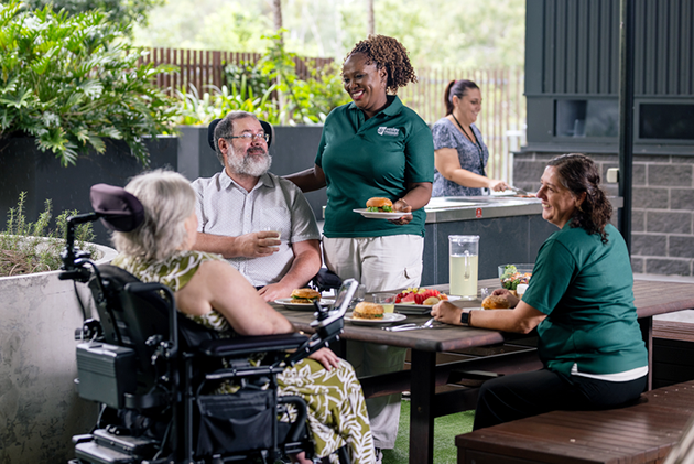 disabiity-accommodation-brisbane-01 Staff and residents in a disability accommodation in Brisbane