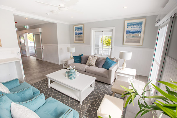 Living room at our Hamptons style Specialist Disability Accommodation in Hope Island, Gold Coast