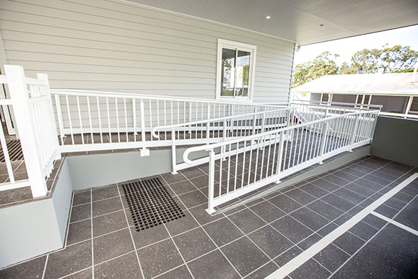 Ramp from disabled parking at our hamptons style Specialist Disability Accommodation in Hope Island, Gold Coast