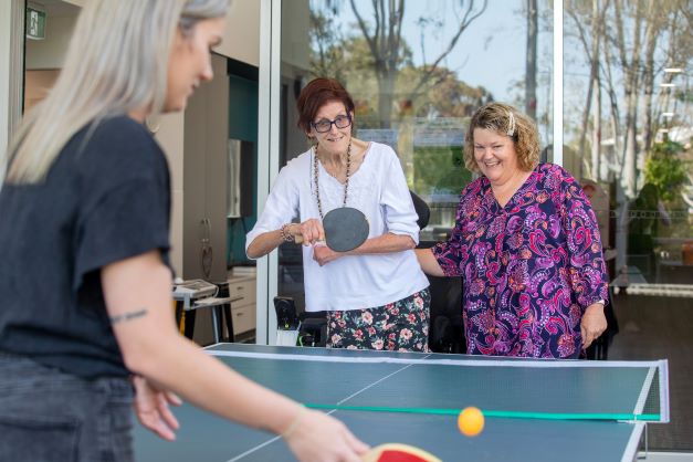 Residents can enjoy activities like table tennis at our specialist disability accommodation