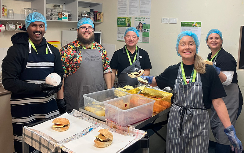 Mum and baby daughter at Hummingbird House entrance door