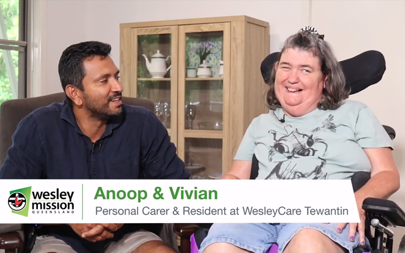 Viv and Anoop, from the disability accommodation WesleyCare Tewantin, chating and smiling.