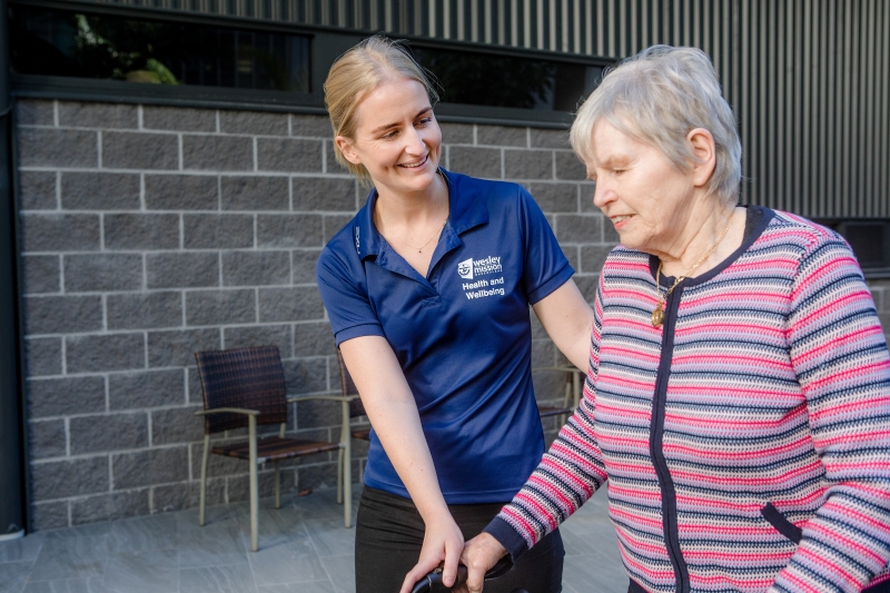 WMQ allied health professional assisting elderly client