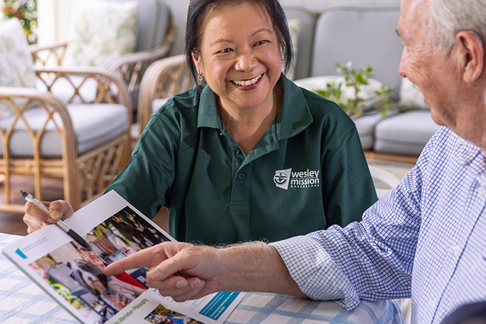 Home Care Brisbane - Staff and couple discussing services and costs
