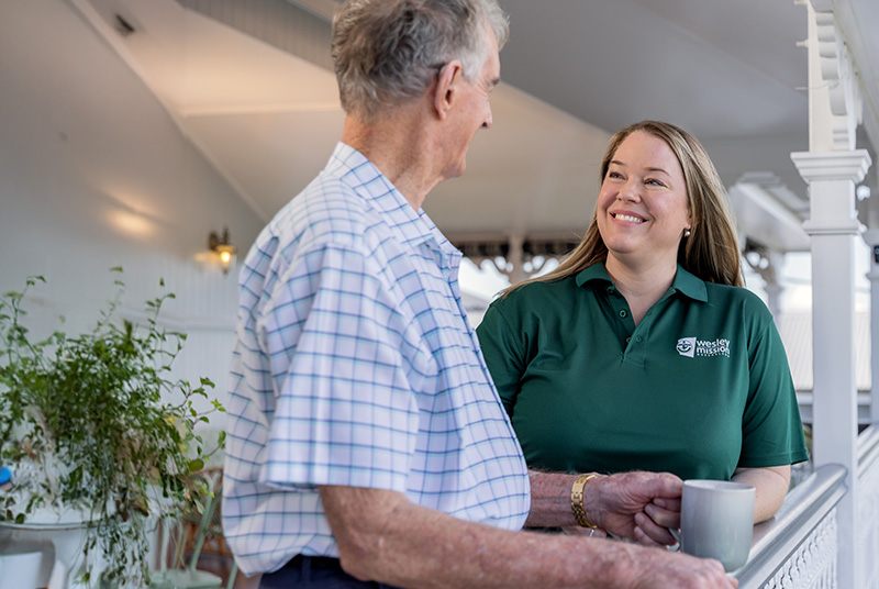 Home Care client having a cuppa at the balcony -Homepage Home Care worker with a client having a cuppa at the balcony