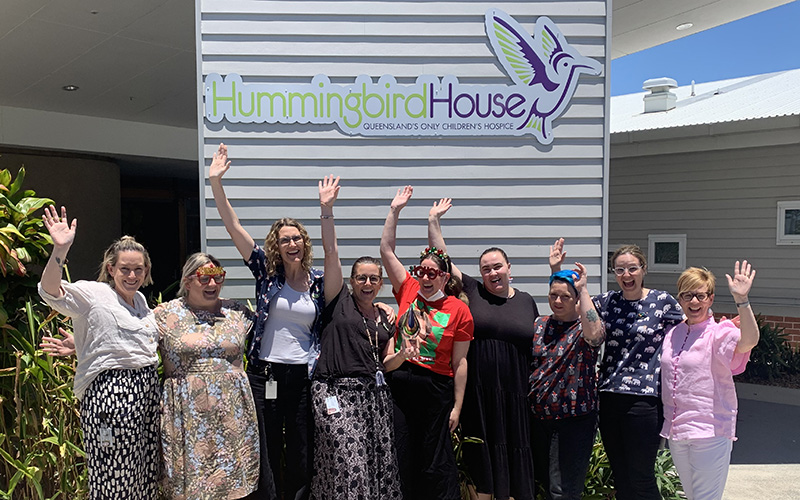 Hummingbird House team celebrates an award from Palliative Care Queensland 2023 for excellence and compassion.