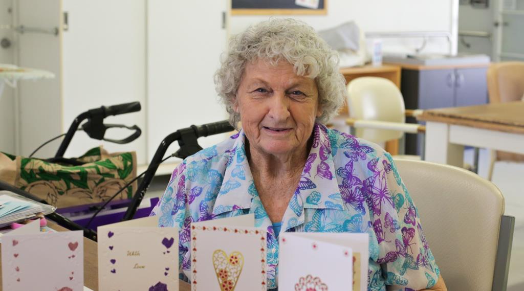 Lady smiles with handmade cards