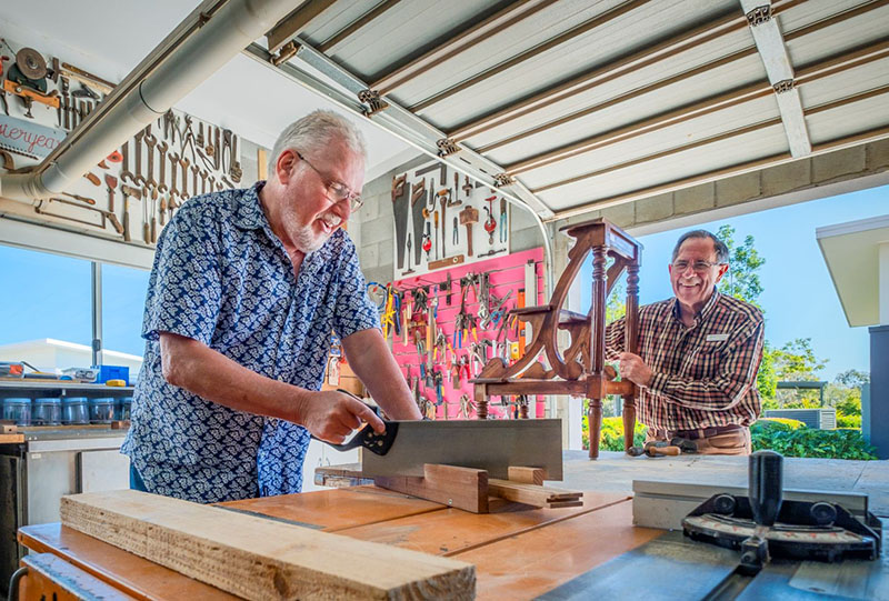 Men at wood workshop at retirement village Wheller on the Park, in Chermside, Brisbane