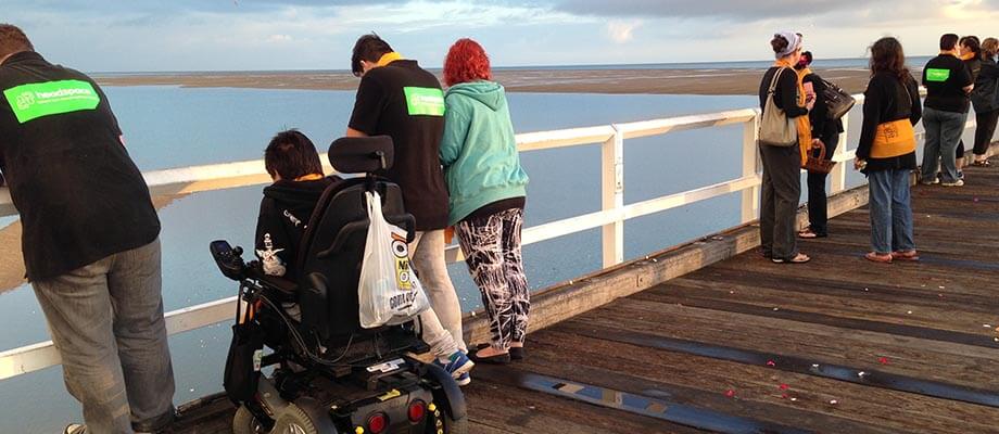Group on a pier during headspace support in Hervey bay