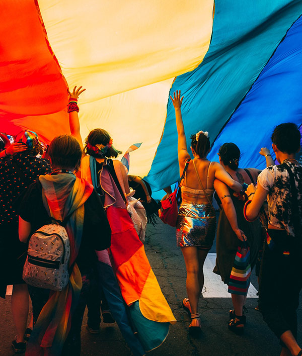 Group of LGBTIQAP+ young people laughing together. Safe Space is a peer-led mental health support group in the Gold Coast