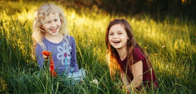 Smiling girls in grass