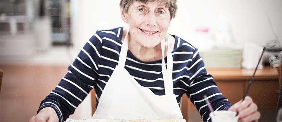 Aged care resident in art class