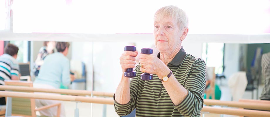 Aged care resident in gym