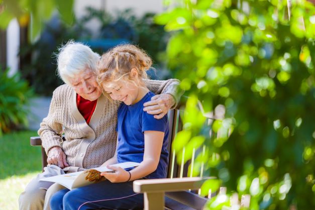 Anam Cara resident reading with granddaughter