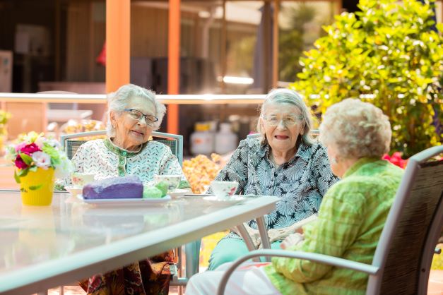Cooper House residents chatting outdoors