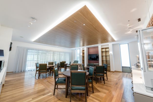 Dining room and kitchen view at Dovetree aged care community