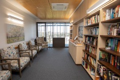 Library with books and chairs for reading