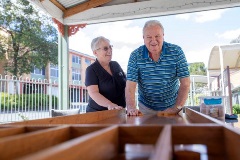 Male resident enjoying a game of shuffleboard