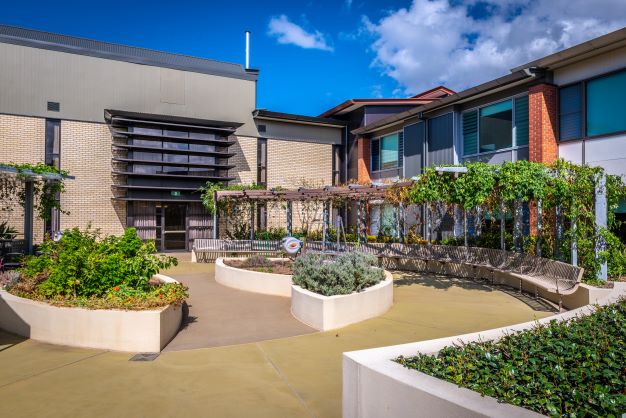 Landscaped garden area at John Wesley Gardens