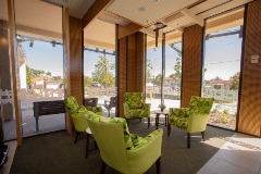Sitting area with floor to ceiling windows and armchairs