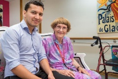 Resident and staff in aged care community home