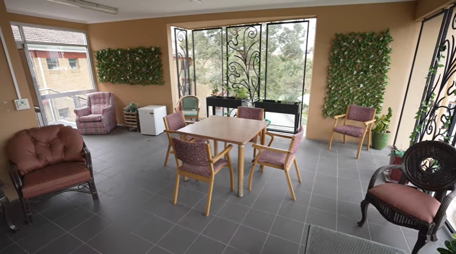 Undercover verandah with armchairs and table