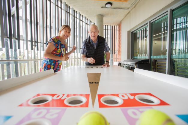 Retiree plays shuffleboard at Hadden Place, a specialised day and overnight respite centre