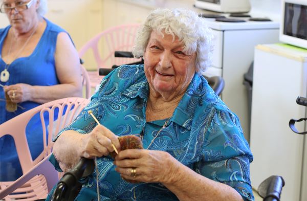 Arana Hills Respite resident knitting