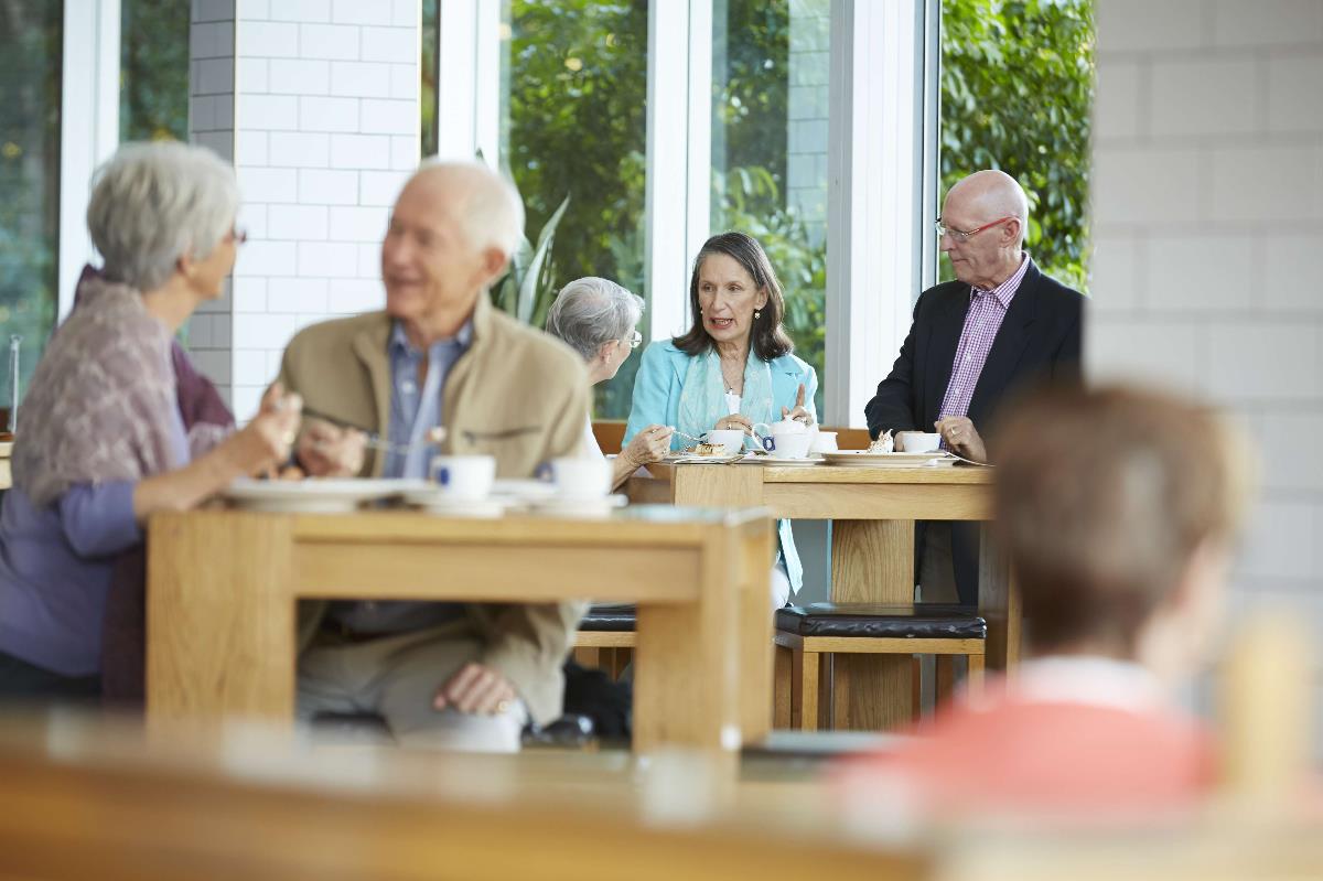 Residents meeting for coffee at Aldersgate retirement apartments