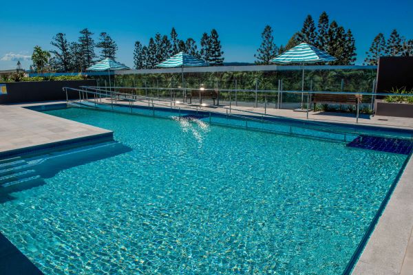 18 metre heated swimming pool at Rosemount Rosemount pool with umbrellas and ramp