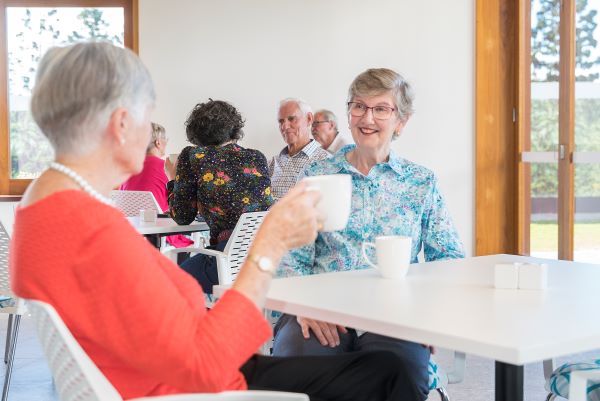 Two residents enjoying coffee at the Cafe at Rosemount