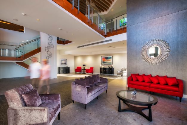 Rosemount Foyer Open foyer area at Rosemount with two people walking by