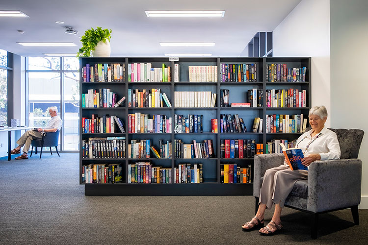 Couple reading in a library