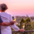 Retirees at the balcony looking at a green landscape, in Rosemount Retirement Village