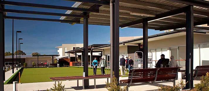 Retirees playing lawn bowls