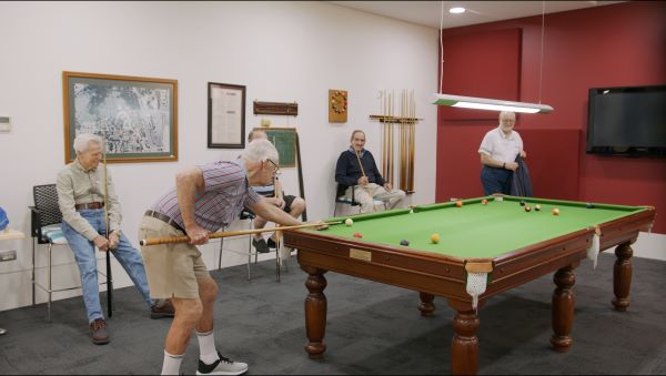 Residents playing pool at Wheller on the Park