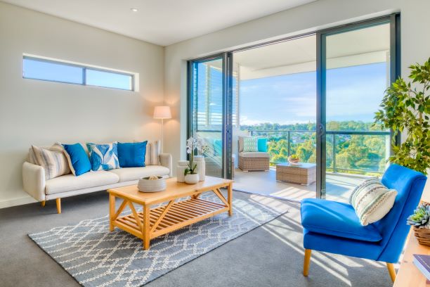 Bright and sunny lounge room with views out over balcony