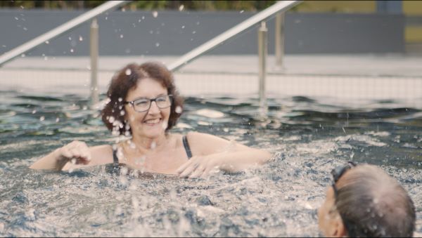 Residents swimming in the pool at Wheller on the Park