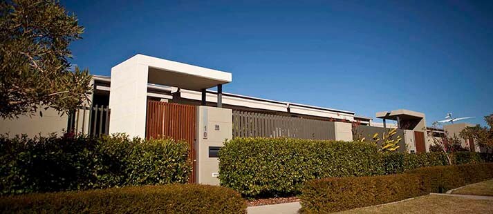 Entrance to a private villa at Wheller on the Park, with landscaped grounds surrounding a gate