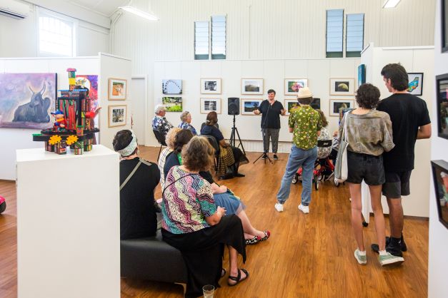 Visitors to the gallery listening to a talk