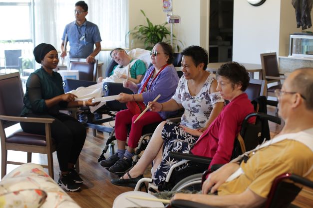 Specialist Disability accommodation residents enjoying a music workshop