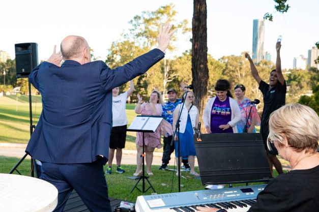 Wesley Arts group enjoying a singing session outdoors