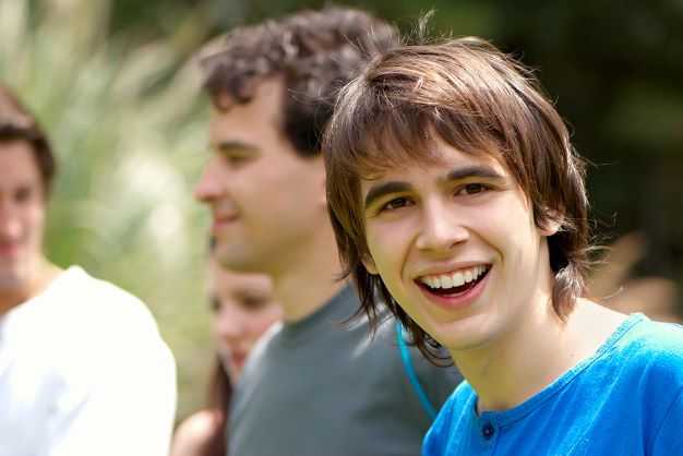 Boy smiling with his friends