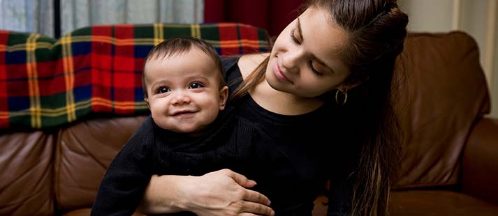 Mother and baby cuddling represents Wesley Mission Queensland's parenting support services