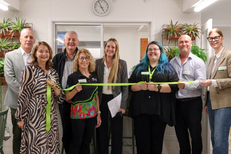 Brisbane Relief Hub and Wesley Mission Queensland team cutting the 