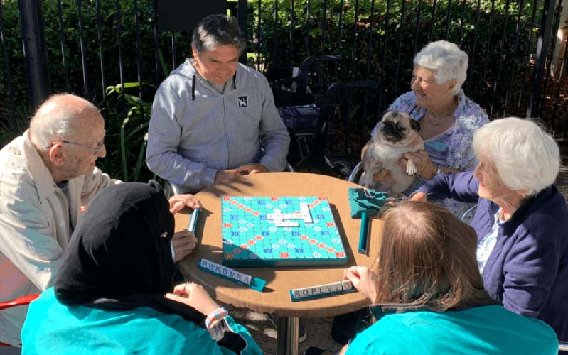 Boardgame in the garden. Eden Alternative Philosophy of Care in action at Anam Cara Aged Care community